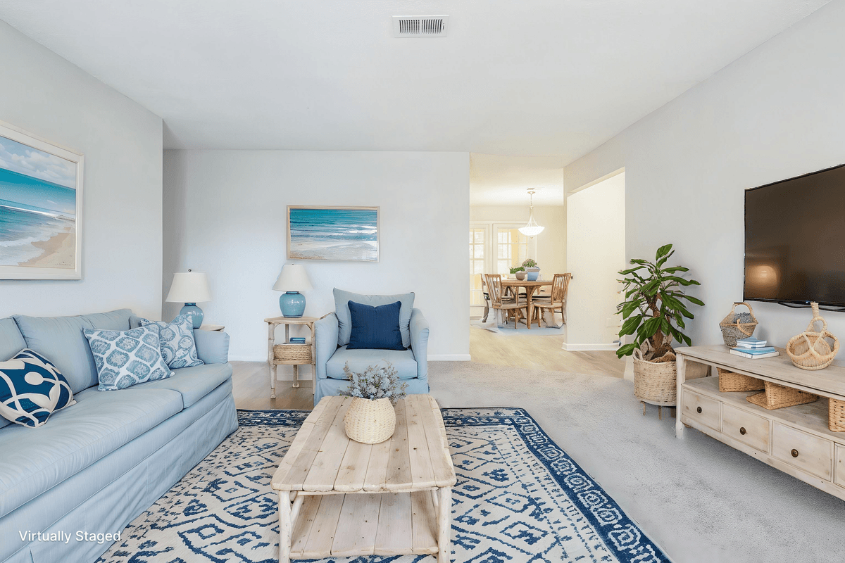 Virtually staged living room in a Quail Run apartment home